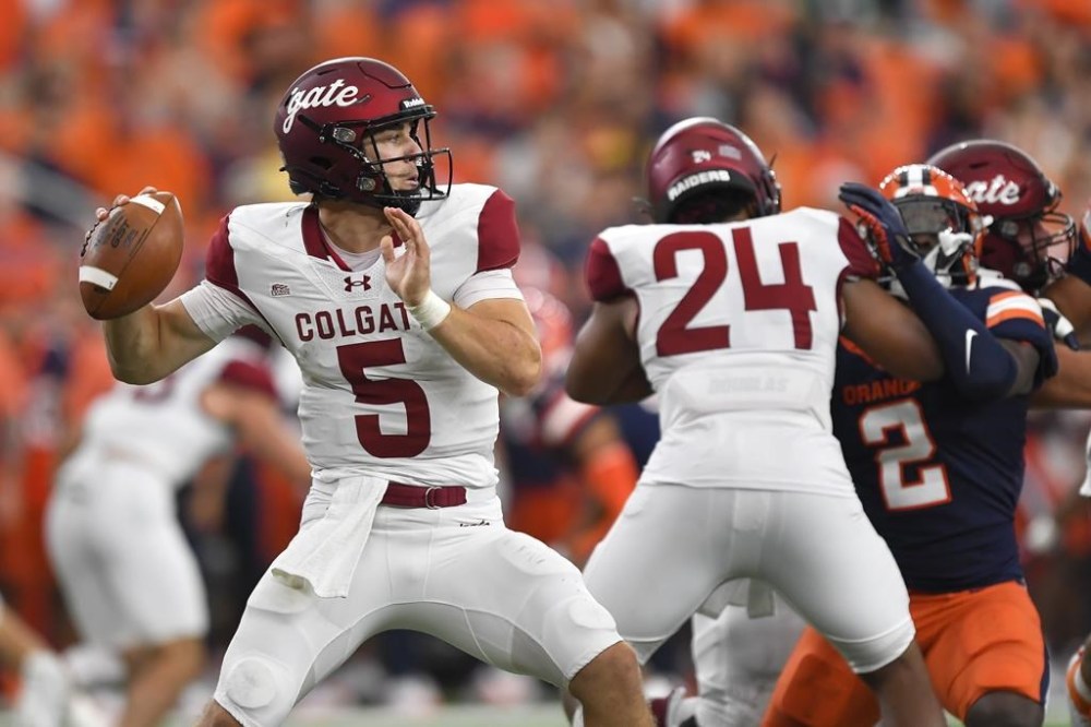 Colgate quarterback Michael Brescia (5) throws from the pocket during the first half of an NCAA college football game against Syracuse in Syracuse, N.Y., Saturday, Sept. 2, 2023. (AP Photo/Adrian Kraus)