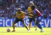 Wolverhampton Wanderers' Mario Lemina, left and Crystal Palace's Eberechi Eze battle for the ball, during the English Premier League soccer match between Wolverhampton Wanderers and Crystal Palace at Selhurst Park, London, Sunday Sept. 3, 2023. (Adam Davy/PA via AP)