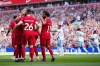 Liverpool's Mohamed Salah, right, celebrates after scoring his side's third goal during the English Premier League soccer match between Liverpool and Aston Villa at Anfield stadium in Liverpool, Sunday, Sept. 3, 2023. (AP Photo/Jon Super)