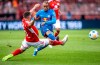 Berlin's Robin Gosens, left, and RB Leipzig's Xavi Simons battle for the ball during the Bundesliga soccer match between FC Union Berlin and RB Leipzig at An der Alten Forsterei stadium in Berlin, Sunday Sept. 3, 2023. (Andreas Gora/dpa via AP)
