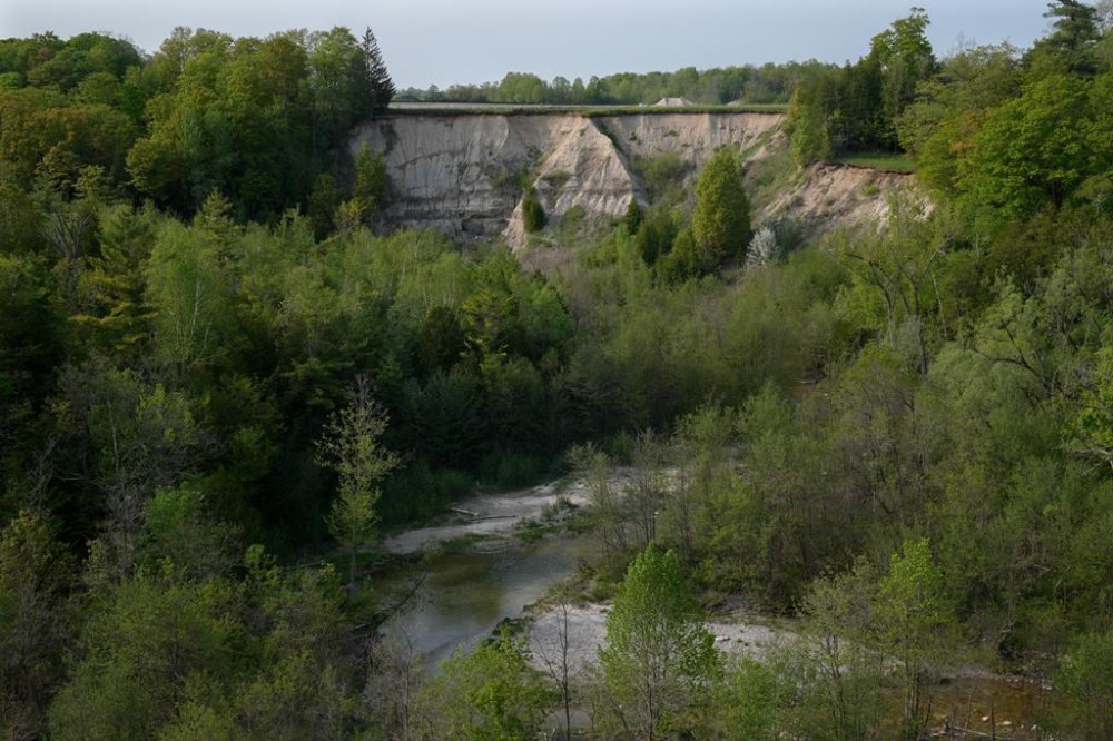 A creek runs through the Duffins Rouge Agricultural Preserve, part of Ontario's Greenbelt, on Monday, May 15, 2023. Embattled Ontario Housing Minister Steve Clark stepped down from his cabinet role on Monday following weeks of criticism over his handling of efforts to remove land from the province's protected Greenbelt. THE CANADIAN PRESS/Chris Young