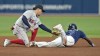 Boston Red Sox second baseman Luis Urias, left, tags out Tampa Bay Rays' Vidal Brujan attempting to steal second base during the fifth inning of a baseball game Monday, Sept. 4, 2023, in St. Petersburg, Fla. (AP Photo/Chris O'Meara)