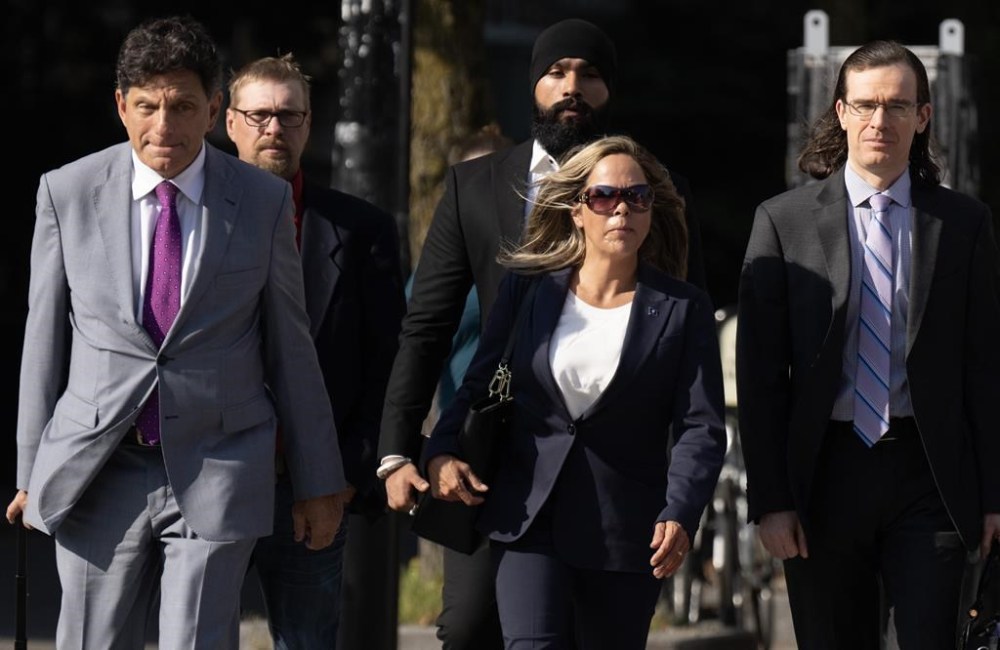 Tamara Lich walks with lawyer Lawrence Greenspan (left) as they make their way to the courthouse on the first day of trial, in Ottawa, Tuesday, Sept. 5, 2023. THE CANADIAN PRESS/Adrian Wyld