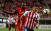 Chivas' Alan Pulido, right, fights for the ball with Toronto FC's Ashtone Morgan during the CONCACAF Champions League final soccer match in Guadalajara, Mexico, Wednesday, April, 25, 2018. Former Toronto FC fullback Morgan, who retired as a player in late July, has rejoined the MLS club as its manager of player engagement and alumni relations. THE CANADIAN PRESS/AP/Eduardo Verdugo