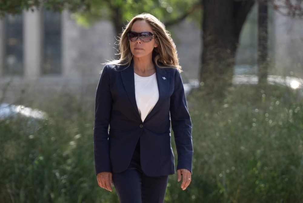 Tamara Lich makes her way back to the courthouse following a brief break on the first day of the trial for