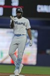 Miami Marlins' Jorge Soler celebrates after hitting a ground rule double during the first inning of a baseball game against the Washington Nationals, Sunday, Aug. 27, 2023, in Miami. (AP Photo/Wilfredo Lee)