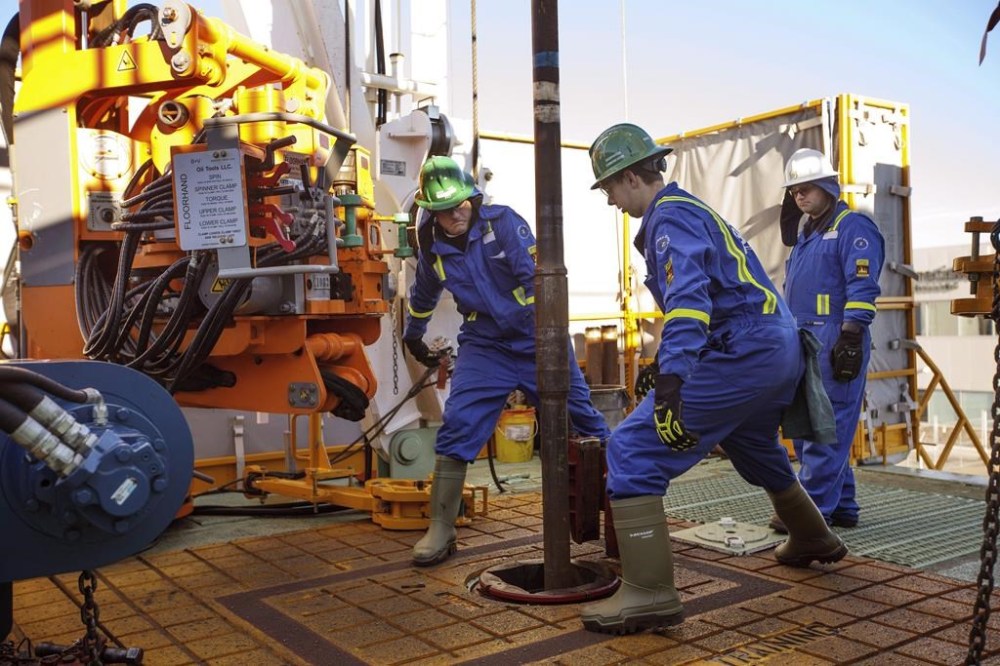 Precision Drilling Corp. has signed an agreement to acquire CWC Energy Services Corp. in a deal valued at about $141 million including shares, cash and assumed debt. Trainees Dan Brook and Bradley Williams are directed by instructor Clint Dyck while training to lay down drill pipe on a rig floor, at Precision Drilling in Nisku, Alta., on January 20, 2016. THE CANADIAN PRESS/Jason Franson