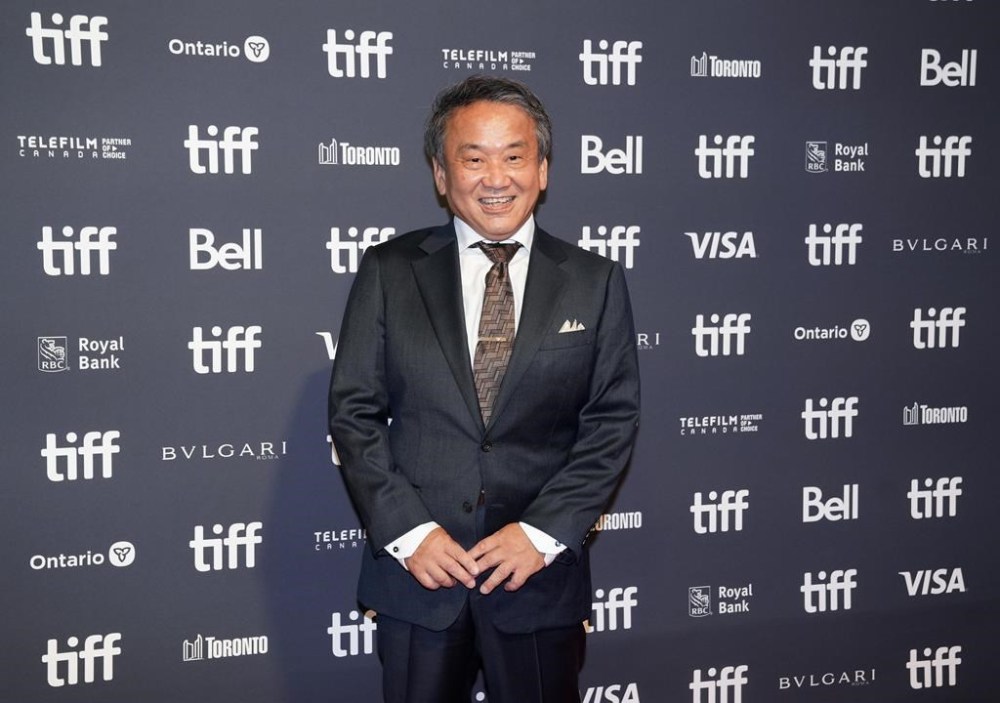 Junichi Nishioka of Studio Ghibli, poses for a photograph on the red carpet for the movie