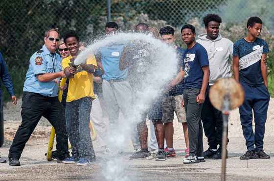 Habeeb Sanni learns the ropes at the Winnipeg Fire Paramedic Service training academy in Winnipeg on Tuesday. The WFPS hosted 36 newcomer youth at a two-day skills training career camp.  Free Press intern Cierra Bettens was there. (John Woods/ Winnipeg Free Press)