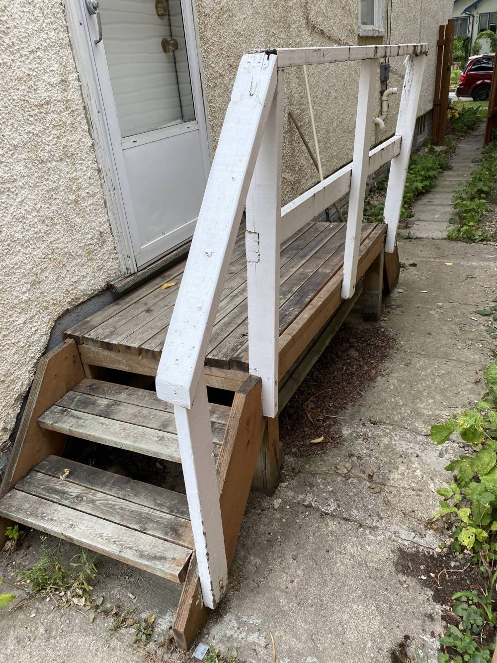 The old steps were unstable and rotten, and the railing was wabbly and easily fell apart during the demolition stage.