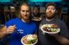 MIKE DEAL / WINNIPEG FREE PRESS
                                Winnipeg Blue Bombers Offensive linemen (from left) Geoff Gray (68), Jermarcus Hardwick (51), and Pat Neufeld (53) in the dressing room with their lunch after practice Friday.