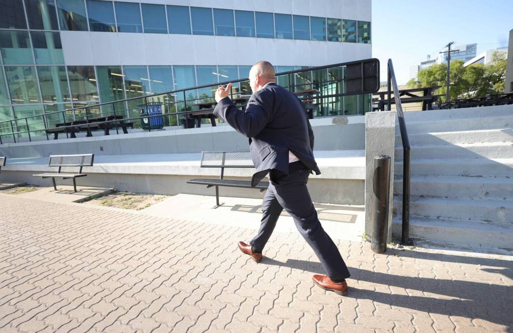 WINNIPEG FREE PRESS
Headingley corrections officer Robert Jeffrey Morden evades the media as he leaves the courthouse Friday afternoon.