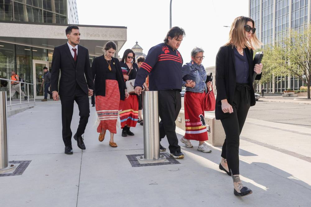 WINNIPEG FREE PRESS
The family of William Ahmo leave the courthouse Friday.