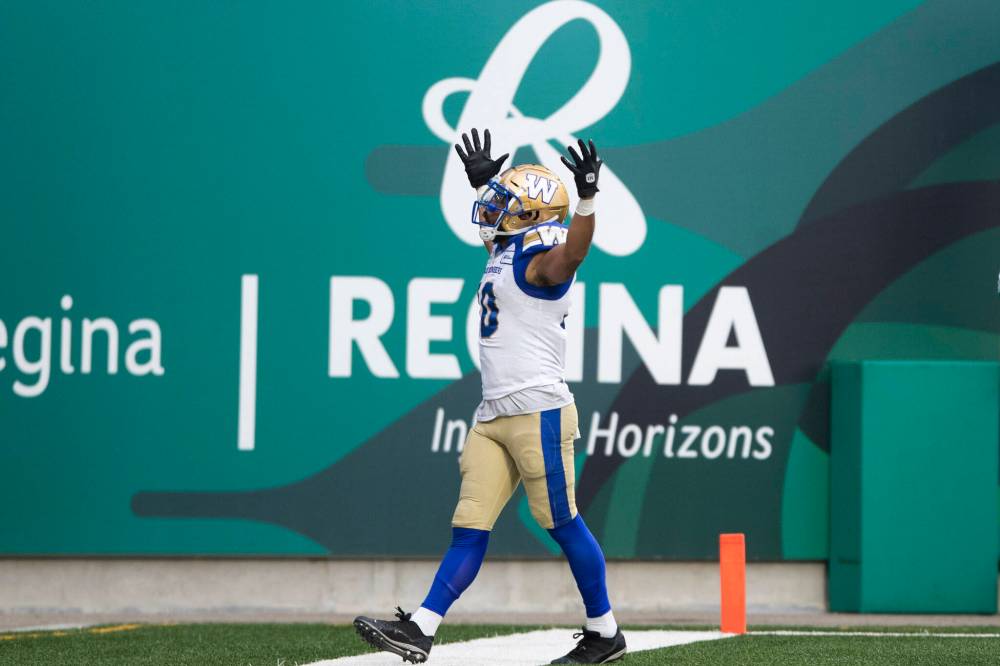 KAYLE NEIS / THE CANADIAN PRESS FILES
Bombers wide receiver Nic Demski celebrates scoring a touchdown during the 2021 Labour Day Classic. He scored the first TD of his CFL career against the Big Blue in the 2015 LDC.