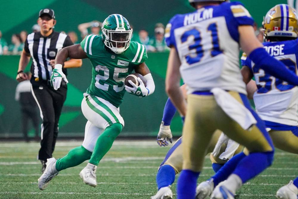 Heywood Yu / THE CANADIAN PRESS
Saskatchewan Roughriders running back Jamal Morrow runs the football against Winnipeg Blue Bombers during the second half of CFL Labour Day Classic.