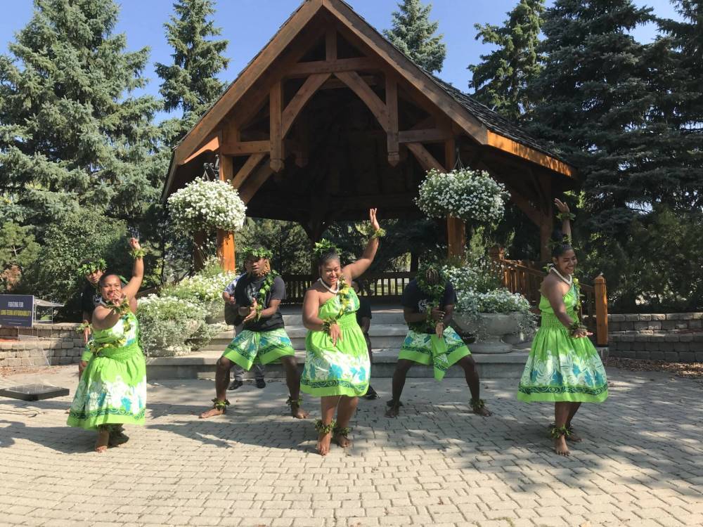 Dancers and drummers with the charity Island Breeze Manitoba perform in a Steinbach after PCs promise to nearly double the charitable donation tax credit if re-elected. (Carol Sanders / Winnipeg Free Press)
