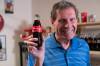 BROOK JONES / WINNIPEG FREE PRESS Winnipegger Morris Glimcher, who was the executive director of the Manitoba High Schools Athletic Association for 40 years before retiring in 2016, shows off his Coca-Cola collection at his home in Winnipeg, Man., Wednesday, Sept. 13, 2023. Glimcher is pictured holding a Coca-Cola bottle with the label that reads Share a Coke with Morris.