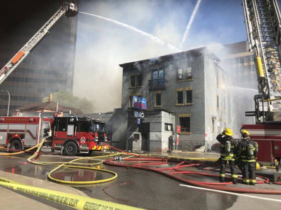 Fire crews battle a fire at the Windsor Hotel on Wednesday. (Ruth Bonneville / Winnipeg Free Press)