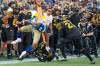 Winnipeg Blue Bombers wide receiver Kenny Lawler (89) is tripped up by Hamilton Tiger Cats defensive back Kenneth George Jr. (3) during second half CFL football game action in Hamilton, Ont., Saturday, Sept. 16, 2023. (Peter Power / The Canadian Press)