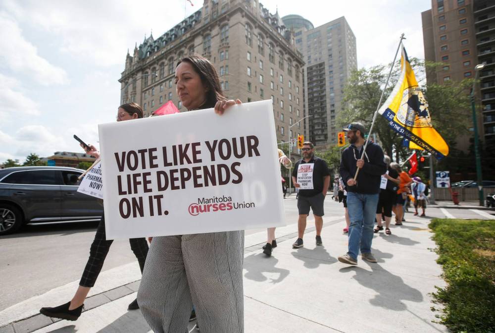 JOHN WOODS / CANADIAN PRESS FILES
Health-care workers and labour unions hold a rally outside the Council of the Federation of Canadian premiers meeting at the Fort Garry Hotel in Winnipeg, July 11.