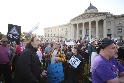 MIKE DEAL / WINNIPEG FREE PRESS
                                Protesters against LGBTTQ+ issues education in public schools were met on the Manitoba Legislative Building grounds by counter-protesters Wednesday morning.