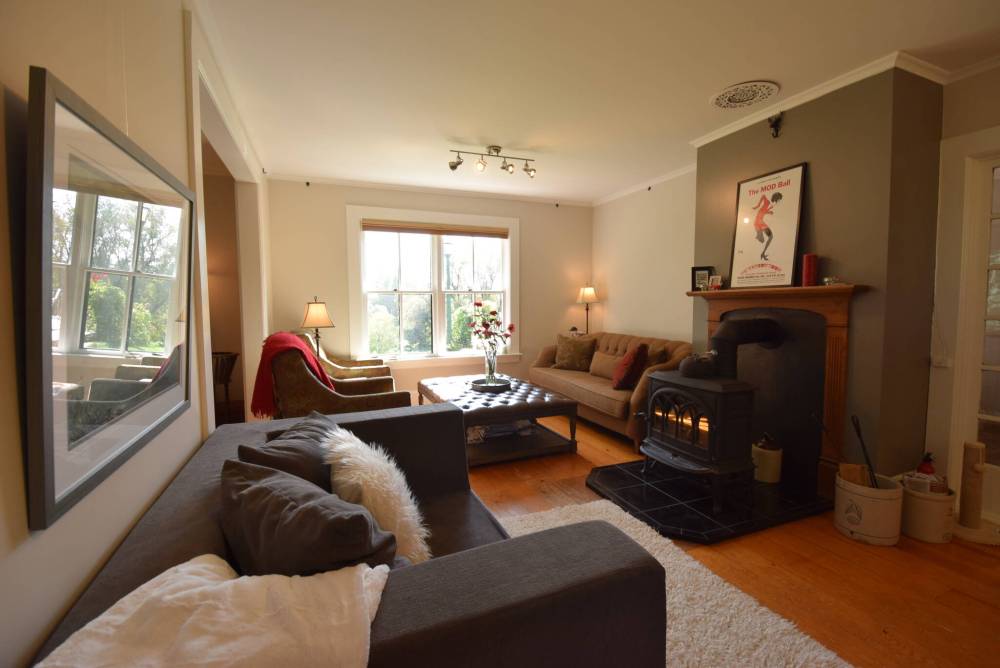 <p>The main house’s living room is a cosy, relaxing space.</p>