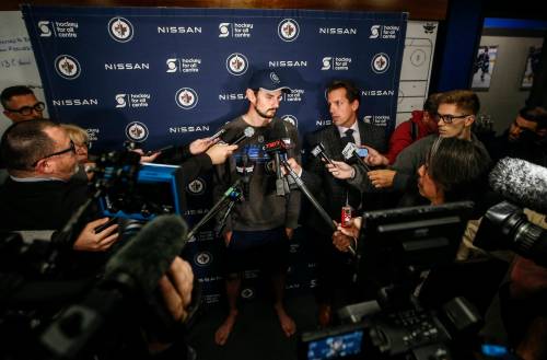JOHN WOODS / THE CANADIAN PRESS
                                Jets netminder Connor Hellebuyck speaks to the media Thursday.
