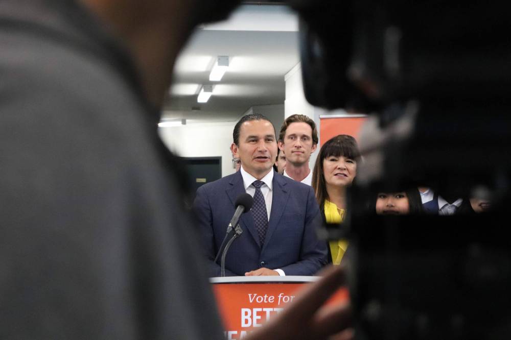 Tyler Searle / Winnipeg Free Press
Opposition leader Wab Kinew issued a plea for voters to vote for his party in the upcoming provincial Friday, while flanked by party members at the Tuxedo Community Centre in south Winnipeg.