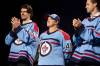 The Winnipeg Jets unveiled a special jersey Saturday paying homage to the Royal Canadian Air Force. From left, Winnipeg Jets alternate captain Mark Scheifele, Royal Canadian Air Force master warrant officer Anita Zacher and Jets alternate captain Josh Morrissey. (Brook Jones/Winnipeg Free Press)