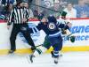 THE CANADIAN PRESS FILES/John Woods
                                Winnipeg Jets’ Neal Pionk and Minnesota Wild’s Mason Shaw collide during NHL action in Winnipeg, March 8, 2023. Pionk says when it comes to judging the quality of his play in the NHL, he is his own worst critic, but he is making inroads at being more positive.