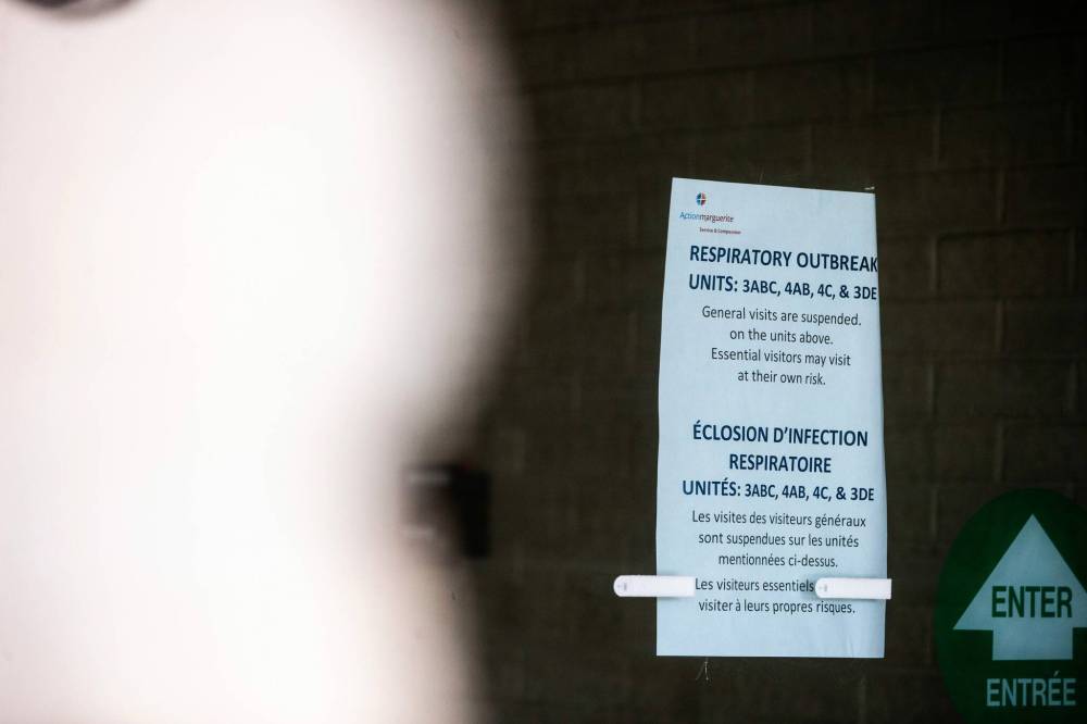 MIKAELA MACKENZIE / WINNIPEG FREE PRESS
A sign on the front door of the Actionmarguerite St. Boniface care home said general visits to affected units were suspended. Essential visitors were allowed to enter at their own risk.