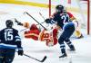 JOHN WOODS / THE CANADIAN PRESS
                                Winnipeg’s Mason Appleton upends Calgary’s Ilya Solovyov on Wednesday during a preseason game between the Jets and the Flames.