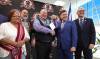 RUTH BONNEVILLE / WINNIPEG FREE PRESS
                                Wawanesa Insurance CFO, Gord Dowhan (blue suit), hands over the key to the building to David Chartrand MMF President after the announcement. Also in the photo Mayor Scott Gillingham, MMF Housing Minister Will Goodon and elder Linda St. Cyr Saric.