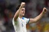 FILE - England's Harry Maguire reacts to fans after winning the World Cup round of 16 soccer match between England and Senegal, at the Al Bayt Stadium in Al Khor, Qatar, Sunday, Dec. 4, 2022. Maguire as been selected in the 26-man squad on Thursday, Aug. 31, 2023 for upcoming games against Ukraine and Scotland. Maguire will also be seen as a contentious selection by England coach Gareth Southgate. The center back hasn’t played a single minute in any of Manchester United’s first three games in the Premier League. (AP Photo/Abbie Parr, File)