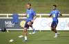 England's Harry Kane, left, and Jude Bellingham in action during a training session at St. George's Park, Burton upon Trent, England, Friday Sept. 8, 2023, a day ahead of the Euro 2024 group C qualifying soccer match between England and Ukraine. (Simon Marper/PA via AP)