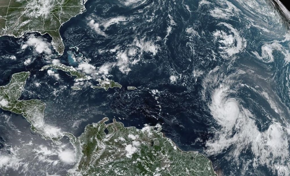 Residents of Canada's East Coast are keeping a close watch on hurricane Lee. Recently released computer-generated forecasts suggest the powerful storm is headed for the Maritimes late next week. But an expert says these long-range 'spaghetti' models are of little use at this stage. This Wednesday, Sept. 6, 2023, satellite image provided by the National Oceanic and Atmospheric Administration shows Hurricane Lee, right, off in the central tropical Atlantic Ocean. (NOAA via AP)