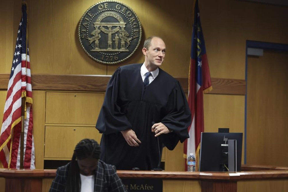 Fulton County Superior Judge Scott McAfee hears motions from attorneys representing Ken Chesebro and Sidney Powell in Atlanta on Wednesday, Sept. 6, 2023. Prosecutors in the Georgia election subversion case involving former President Donald Trump said Wednesday that a trial would likely take four months. Chesebro and Powell have filed demands for a speedy trial, meaning their trials would need to get underway by very early November. (Jason Getz/Atlanta Journal-Constitution via AP)