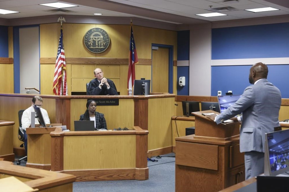 Special Prosecutor Nathan Wade, representing the District Attorney's office, argues before Fulton County Superior Judge Scott McAfee as he hears motions from attorneys representing Ken Chesebro and Sidney Powell in Atlanta on Wednesday, Sept. 6, 2023.(Jason Getz/Atlanta Journal-Constitution via AP, Pool)