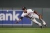 Minnesota Twins second baseman Jorge Polanco tosses the ball to second base for the out on New York Mets' Pete Alonso during the ninth inning of a baseball game Friday, Sept. 8, 2023, in Minneapolis. (AP Photo/Abbie Parr)