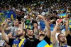 Fans of Ukraine hold smartphones with torches switched on during the Euro 2024 group C qualifying soccer match between Ukraine and England in Wroclaw, Poland, Saturday, Sept. 9, 2023. (AP Photo/Czarek Sokolowski)