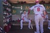 Los Angeles Angels' Shohei Ohtani (17) is greeted in the dugout by Mike Moustakas (8) before a baseball game against the Oakland Athletics in Oakland, Calif., Sunday, Sept. 3, 2023. (AP Photo/Jeff Chiu)