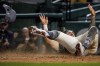 Washington Nationals' Michael Chavis scores on a wild pitch to end the game in the 11th inning of a baseball game against the Los Angeles Dodgers at Nationals Park, Saturday, Sept. 9, 2023, in Washington. The Nationals won 7-6. (AP Photo/Andrew Harnik)