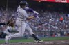 Colorado Rockies' Hunter Goodman hits a two-run triple during the second inning of a baseball game against the San Francisco Giants in San Francisco, Sunday, Sept. 10, 2023. (AP Photo/Jeff Chiu)