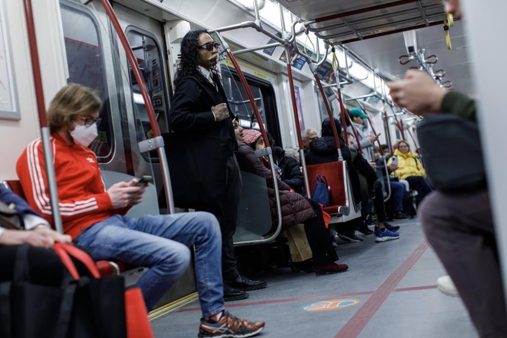 Subway riders with all cellular carriers will gain access to the wireless network previously available only to Rogers and Freedom customers by Oct. 3, the federal government said. Riders take a subway train on the Toronto Transit Commission station in downtown Toronto, Saturday, April 1, 2023. THE CANADIAN PRESS/Cole Burston