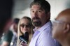 FILE - Retired Colorado Rockies first baseman Todd Helton talks to reporters before a baseball game Saturday, Aug. 19, 2023, in Denver. Helton is teaming up with the organization RIP Medical Debt to help eliminate $10 million in medical bills for residents around the state. The program is set to start later this month, with recipients around Colorado receiving letters that notify them their medical bills have been paid in full. (AP Photo/David Zalubowski, File)