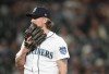 Seattle Mariners relief pitcher Gabe Speier reacts after walking Los Angeles Angels' Zach Neto, prompting manager Scott Servais to approach the mound to take him out of the 11th inning of a baseball game Monday, Sept. 11, 2023, in Seattle. The Angels won 8-5. (AP Photo/Lindsey Wasson)