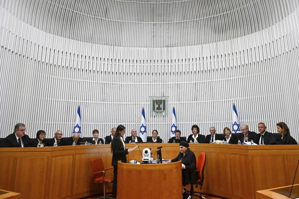 All 15 of Israel's Supreme Court justices appear for the first time in the country's history to look at the legality of Prime Minister Benjamin Netanyahu's contentious judicial overhaul, which the government pushed through parliament in July, in Jerusalem, Tuesday, Sept. 12, 2023. The divisive law, which cancels the court's ability to block government actions and appointments using the legal concept that they are