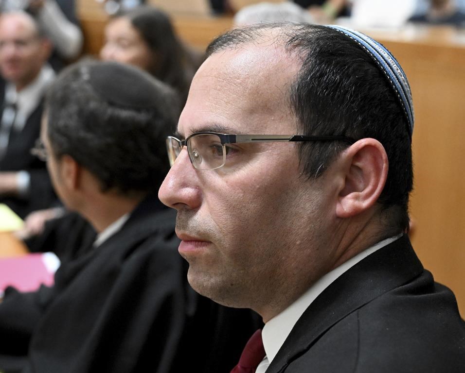 Israeli lawmaker Simcha Rothman arrives at the Supreme Court where all of Israel's Supreme Court justices will look at the legality of Prime Minister Benjamin Netanyahu's contentious judicial overhaul, which the government pushed through parliament in July, in Jerusalem, Tuesday, Sept. 12, 2023. The divisive law, which cancels the court's ability to block government actions and appointments using the legal concept that they are