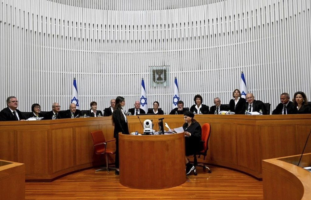 All 15 of Israel's Supreme Court justices appear for the first time in the country's history to look at the legality of Prime Minister Benjamin Netanyahu's contentious judicial overhaul, which the government pushed through parliament in July, in Jerusalem, Tuesday, Sept. 12, 2023. The divisive law, which cancels the court's ability to block government actions and appointments using the legal concept that they are