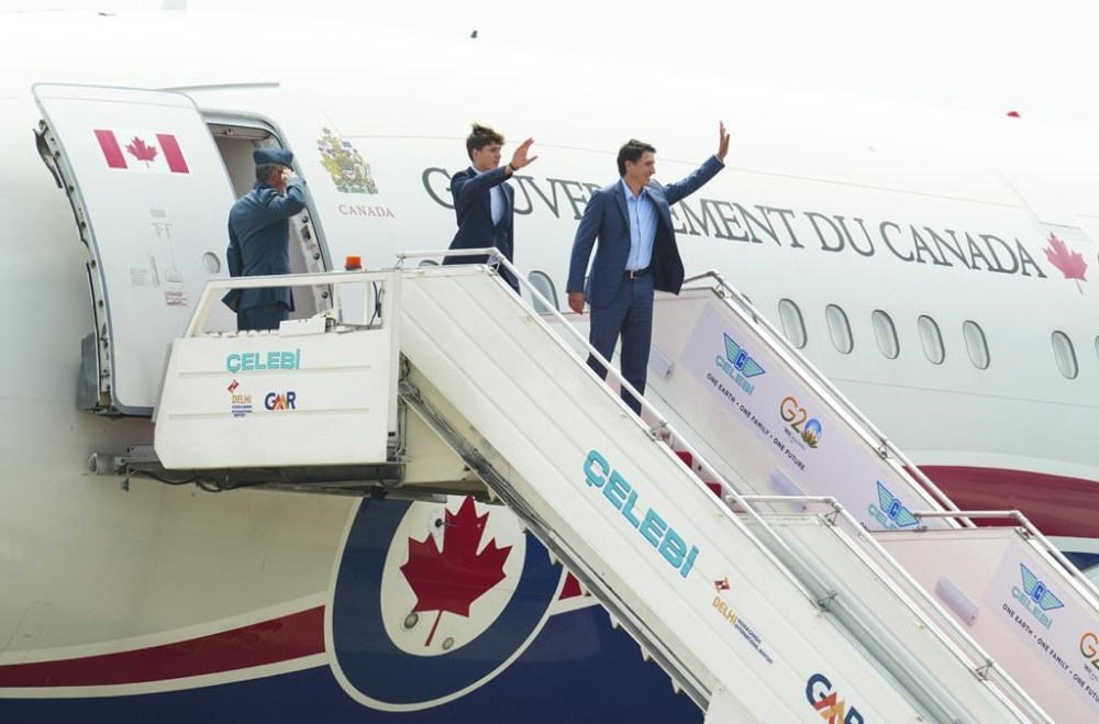 Prime Minister Justin Trudeau and son Xavier depart New Delhi, India on Tuesday, Sept. 12, 2023. Trudeau's departure was delayed several days due to a technical issue with his military aircraft. THE CANADIAN PRESS/Sean Kilpatrick